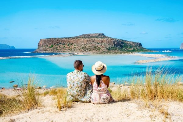 Couple Looking Out At Balo Beach, Crete, Greece